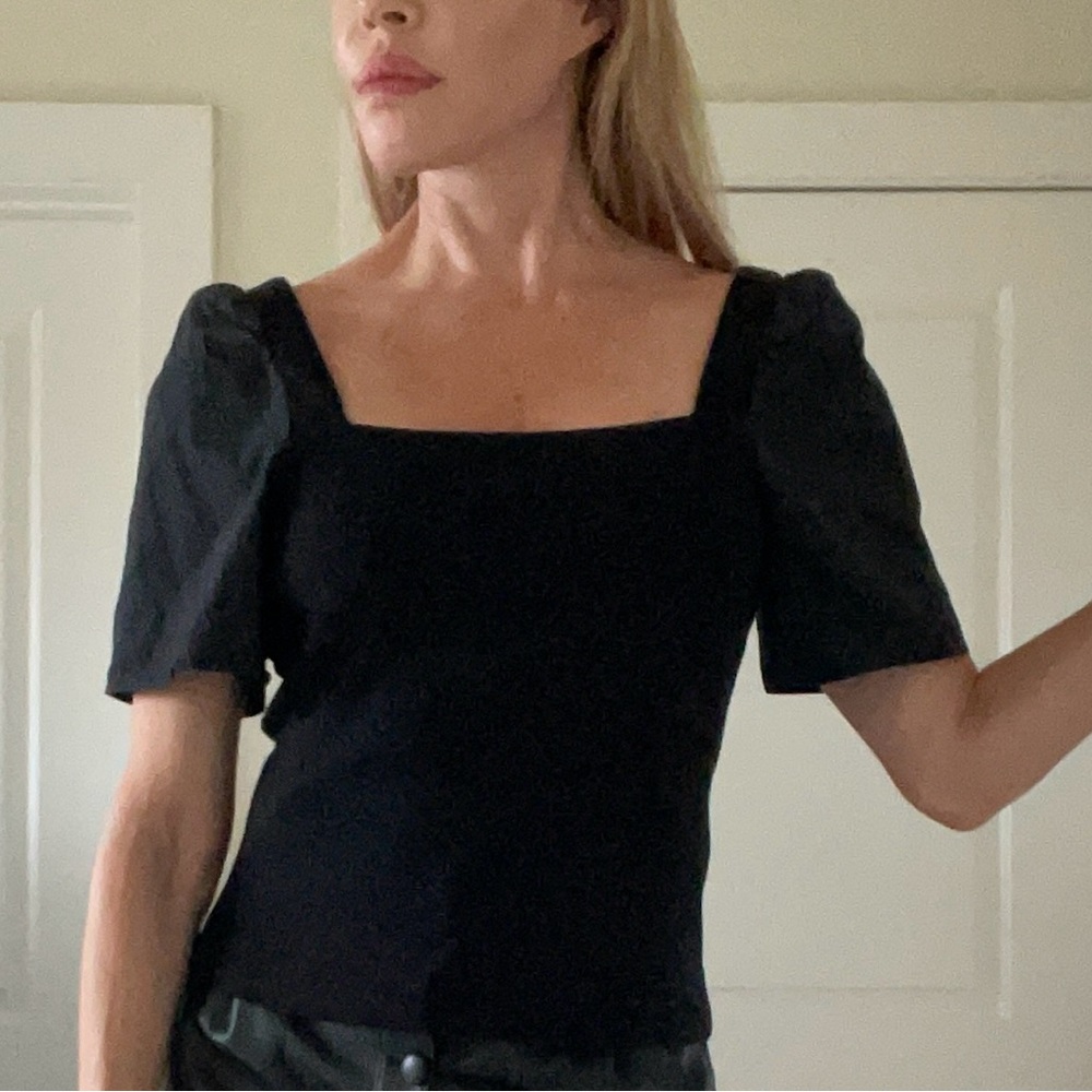 1.State black top w puff sleeves and tailored body.